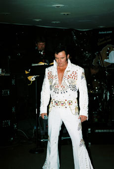 Mike as Elvis in white jumpsuit